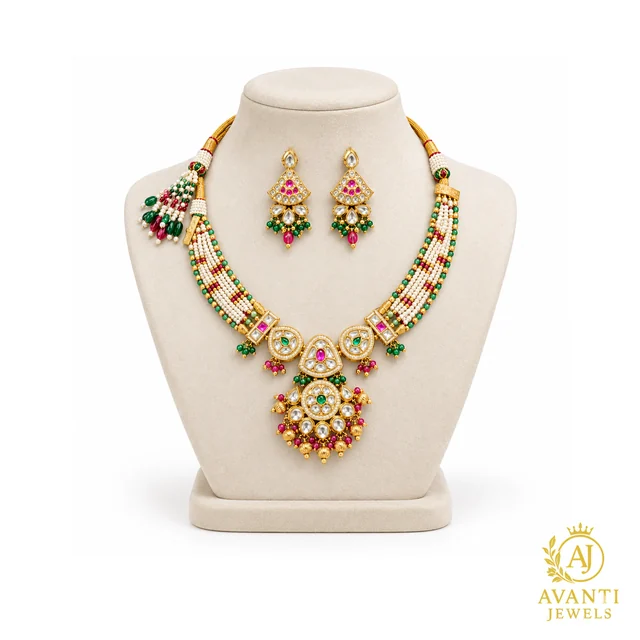 Necklace and matching earrings displayed on an ivory jewelry bust